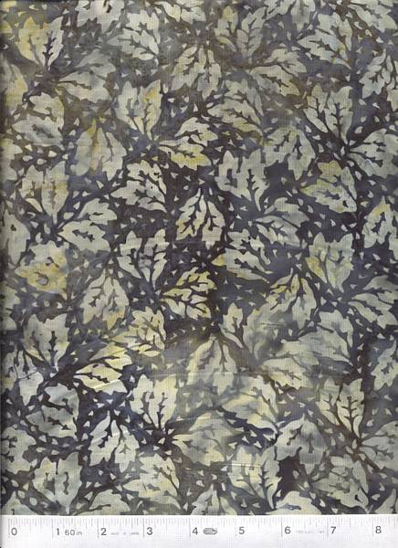 A stunning and beautiful varigated dyed batik with accents of leaves in a smoky grey/black color.